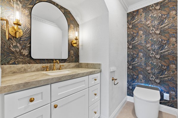 Powder Bathroom Remodel - Simple yet impactful remodel:
We maximized storage with a sleek new vanity and added character to the bathroom with a stylish wallpaper accent wall. A smart toilet and wall-mounted sconces create a cozy, inviting vibe, blending function with a touch of luxury. Powder Bathroom Remodel - Simple yet impactful remodel:
We maximized storage with a sleek new vanity and added character to the bathroom with a stylish wallpaper accent wall. A smart toilet and wall-mounted sconces create a cozy, inviting vibe, blending function with a touch of luxury.