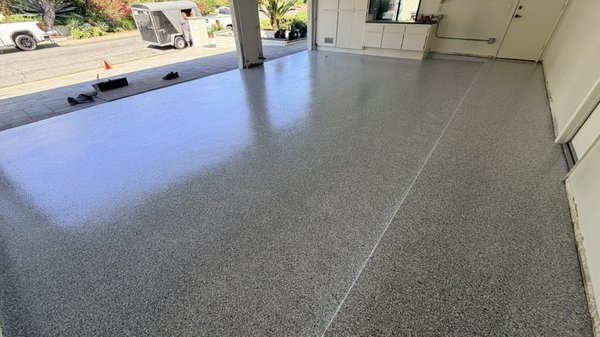3-Car Silver Bells Epoxy Garage Floor – Claremont - Removed the existing coating, repaired the damaged area at the garage entrance, diamond-ground the concrete, and installed a Silver Bells full-flake epoxy system with non-yellowing polyaspartic clear coat. 3-Car Silver Bells Epoxy Garage Floor – Claremont - Removed the existing coating, repaired the damaged area at the garage entrance, diamond-ground the concrete, and installed a Silver Bells full-flake epoxy system with non-yellowing polyaspartic clear coat.