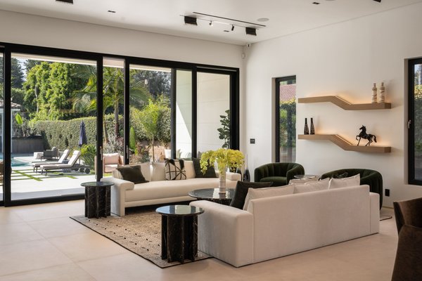 Sherman Oaks - Full Home Remodel - This stunning transformation features a modern kitchen remodel with custom cabinetry, quartz countertops, and high-end appliances, plus luxury bathroom renovations with walk-in showers and floating vanities. The open-concept living space boasts new flooring, recessed lighting, and custom millwork, while the master suite makeover includes a spa-like en-suite and walk-in closet. Exterior upgrades like fresh stucco and landscaping enhance curb appeal. Our expert home remodeling team delivers high-quality craftsmanship and stunning results.