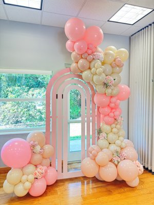 Baby Shower for Sofia Jolie - Create a stunning, modern, and chic atmosphere with our luxurious event backdrop, designed in beautiful shades of pink. This elegant backdrop features a blend of soft pink hues, perfectly complemented by a stunning array of organic balloon garlands that flow gracefully across the space. The addition of delicate flowers enhances the overall charm, bringing a touch of nature to the luxurious design. Baby Shower for Sofia Jolie - Create a stunning, modern, and chic atmosphere with our luxurious event backdrop, designed in beautiful shades of pink. This elegant backdrop features a blend of soft pink hues, perfectly complemented by a stunning array of organic balloon garlands that flow gracefully across the space. The addition of delicate flowers enhances the overall charm, bringing a touch of nature to the luxurious design.