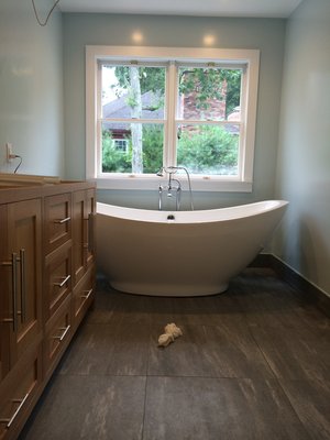 Freestanding Tub with Floor Mounted Faucet - This is a beautiful, freestanding tub and faucet which were installed after all the tile work was completed. The plumbing had to be exact and accurate prior to tiling.