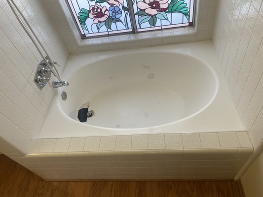 Moreno Valley bathtub repair and reglaze - This bathtub had been damaged by water dripping non stop. It wore through the porcelain and rusted the cast iron underneath until it rotted away a small hole near the drain. We were able to repair it and refinish it to look new again. Moreno Valley bathtub repair and reglaze - This bathtub had been damaged by water dripping non stop. It wore through the porcelain and rusted the cast iron underneath until it rotted away a small hole near the drain. We were able to repair it and refinish it to look new again.