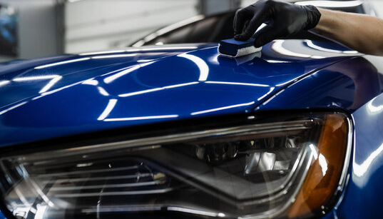 Mobile Ceramic Coating - a liquid polymer applied to a vehicle's exterior that bonds with the paint, creating a durable, hydrophobic layer for protection against elements, dirt, and grime, offering a semi-permanent shield. call now for an estimate