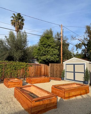 PLANTER BOX GARDEN & FENCE - Client wanted a Planter Box Garden, Pea Gravel covering, & Fence on each side of the shed out of recycled wood. Very open feel with additional storage on each side of the shed behind the fence, away from view. PLANTER BOX GARDEN & FENCE - Client wanted a Planter Box Garden, Pea Gravel covering, & Fence on each side of the shed out of recycled wood. Very open feel with additional storage on each side of the shed behind the fence, away from view.