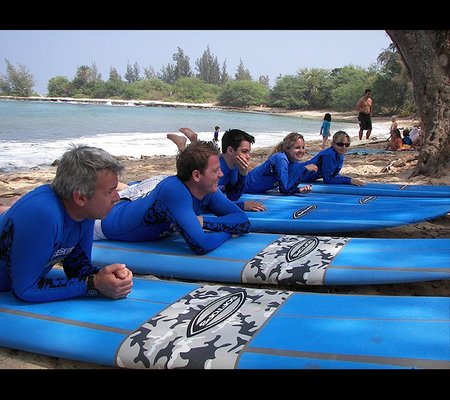 Group & Family Surf Lessons! - Join a group surf lesson and learn to ride the waves with our experienced instructors.

Located on the North Shore of Oahu, our surf school is licensed and insured, and our lifeguards are Red Cross certified. You’re sure to get the best instruction with our balanced student-to-instructor ratio.

Feel safe on the water and have a blast learning to surf. Book through our website with promotional code Aloha for 15% off a group lesson!