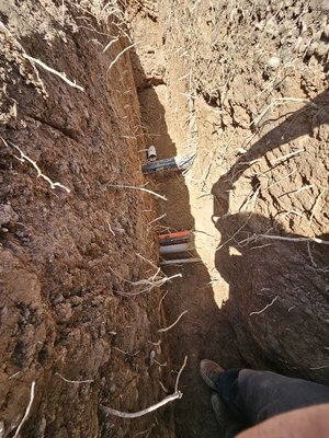 Sewer and Drain Job - We recently completed a comprehensive drain and sewer repair that transformed a failing system into a reliable, modern installation. Our process began with a detailed camera inspection that revealed multiple issues: a collapsed pipe section, significant root intrusion, and scale buildup throughout the aging clay pipe system.

Our professional team handled everything from permit acquisition to utility marking before carefully excavating along the pipe path. We replaced the damaged sections with high-quality 4-inch PVC SDR 35 sewer pipes, which provide superior flow and durability compared to the original clay pipes.

To prevent future problems, we installed a specialized root barrier along the entire pipe length and added strategic clean-out access points for easier maintenance. For a section beneath a mature oak tree, we used innovative trenchless pipe lining technology to avoid damaging the tree's root system.
Every step of our work was meticulously executed, from creating proper bedding with crushed stone to carefully compacting backfill layers to prevent settling. We conducted hydrostatic testing to verify a leak-free installation before restoring the property with fresh sod, repaired concrete, and new mulch.
Our service includes complete documentation with video records and a detailed map of the new system. All materials and workmanship come with a 10-year warranty, and we schedule a follow-up inspection 12 months after completion to ensure everything continues functioning perfectly.

When you need reliable, professional drain and sewer repair that's built to last, our experienced team delivers solutions that combine technical expertise with property-conscious work methods.