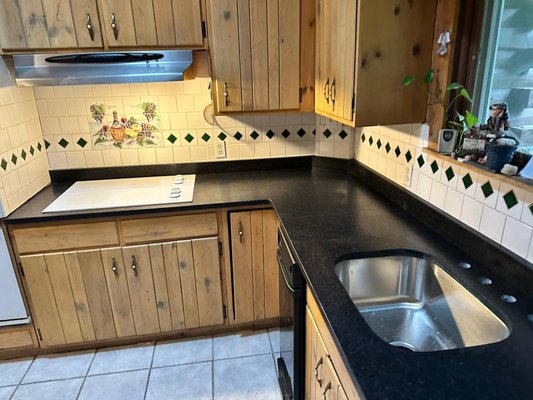 Black Pearl Leathered - The Formica in this home had seen better days.  It was replaced with Black Pearl Granite.