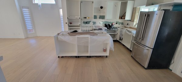 Engineered Flooring Installation - This home owner decided to renovate her main floor, from kitchen to dining room. Wildrose Hardwood was brought in to design and lay down white oak engineered flooring. Engineered Flooring Installation - This home owner decided to renovate her main floor, from kitchen to dining room. Wildrose Hardwood was brought in to design and lay down white oak engineered flooring.