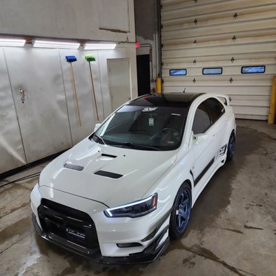 Exterior Detail - Special Edition Lancer Evo. The owner couldn't remove the caked on soot from the back end that accumulated from his exhaust along with mentioning that the paint just doesnt look like it used to and the color of the rims were not as vibrant.
As seen in the photos, after our exterior detail procedure, the car looks new again with not even a hint of soot on the rear end. Exterior Detail - Special Edition Lancer Evo. The owner couldn't remove the caked on soot from the back end that accumulated from his exhaust along with mentioning that the paint just doesnt look like it used to and the color of the rims were not as vibrant.
As seen in the photos, after our exterior detail procedure, the car looks new again with not even a hint of soot on the rear end.
