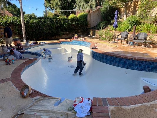 White Pool Plaster - Custom 15’ bench, white pool plaster and new blue tile.
