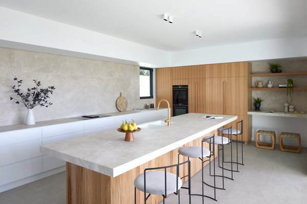 Modern Laminam Diamond Cream Kitchen - Uncomplicated clean lines, sleek and simple cabinet hardware, and a neutral color palette. LAMINAM Diamond cream countertops add a touch of warmth and elegance to the space. Modern Laminam Diamond Cream Kitchen - Uncomplicated clean lines, sleek and simple cabinet hardware, and a neutral color palette. LAMINAM Diamond cream countertops add a touch of warmth and elegance to the space.