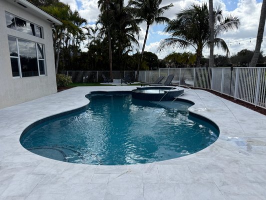Wellington Pool, Deck, Kitchen and Turf Project - Complete backyard transformation featuring new marble decking in a French pattern, updated tile and coping, and a fresh pool surface for a clean, modern finish. This project also includes the addition of laminars for a sleek water feature, along with a custom outdoor kitchen to create a fully functional outdoor living space.
Designed with both aesthetics and durability in mind, this renovation delivers a seamless, resort-style backyard built for Florida living. Wellington Pool, Deck, Kitchen and Turf Project - Complete backyard transformation featuring new marble decking in a French pattern, updated tile and coping, and a fresh pool surface for a clean, modern finish. This project also includes the addition of laminars for a sleek water feature, along with a custom outdoor kitchen to create a fully functional outdoor living space.
Designed with both aesthetics and durability in mind, this renovation delivers a seamless, resort-style backyard built for Florida living.