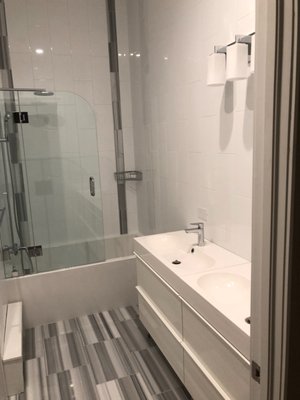 Modern New Construction Bathrooms - This project features a series of custom-designed bathrooms in a new construction home, each tailored for luxury, function, and style.

The primary suite features a spa-inspired layout, complete with full-height marble-look porcelain tile, a frameless glass walk-in shower equipped with dual rainheads and body sprays, and a deep soaking tub set within a stone surround. A double vanity with quartz countertops, sleek fixtures, and recessed medicine cabinets completes the look.

Secondary bathrooms showcase clean, modern lines with floating vanities, large-format tile, and minimalist frameless glass enclosures.

The powder room is compact yet bold, finished with backlit mirrors, wall-mounted fixtures, and textured tile for visual impact.