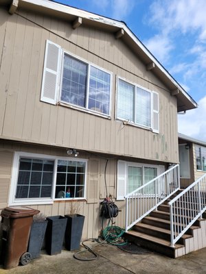 Troutdale Whole-Home Exterior Transformation - What started as a simple request to replace two windows evolved into a complete whole-home exterior transformation. Over the years, multiple additions had left this Troutdale home with mismatched siding profiles, window sizes, and exterior details. During the process, we discovered and repaired significant underlying water damage and dry-rotted framing before installing unified siding, replacement windows, new gutters, and integrated weatherproofing. The end result is a seamless, cohesive look that makes the entire structure feel like it was originally built as one.