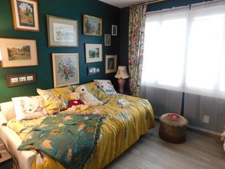 English-Inspired Guest Room - What was once a guest room overflowing with storage containers and miscellaneous items was transformed into a beautiful English-inspired retreat celebrates my clients family heritage..