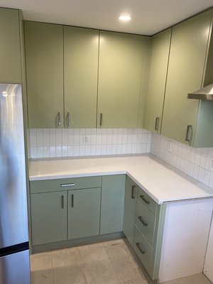 Kitchen Backsplash with hardware - Beautiful kitchen was a little skeptical about the green but it seems to work. The client went with the subway styled tile for the backsplash and it seems to work. We had to install the hood after the backsplash was installed to give it a more modern feel. Kitchen Backsplash with hardware - Beautiful kitchen was a little skeptical about the green but it seems to work. The client went with the subway styled tile for the backsplash and it seems to work. We had to install the hood after the backsplash was installed to give it a more modern feel.
