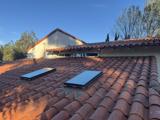 Clay Spanish tile - complete lift and relay - Spanish tile lift and relay project in Porter Ranch, we replaced damaged wood on the decking , installed tile seal underlayment and installed 4 new skylights to brighten the home and give long lasting protection.