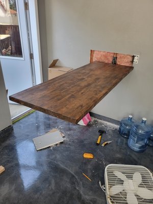Floating Table Install - Customer was in the middle of planning a new wet bar and lounge area in his garage and wanted a legless table for games and cocktails. All in a day's work! Floating Table Install - Customer was in the middle of planning a new wet bar and lounge area in his garage and wanted a legless table for games and cocktails. All in a day's work!