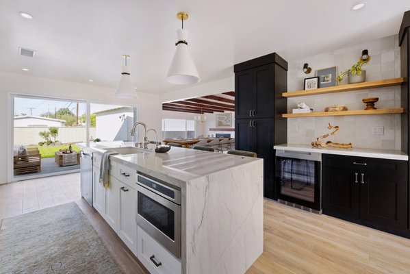 Lave Ave, Long Beach - This comprehensive project included a major addition to create a new primary suite with a spacious bedroom, luxurious bathroom, walk-in closet, and convenient laundry room. The kitchen was expanded and reimagined as the heart of the home, complete with a large island and built-in pantry. It’s perfect for everything from casual meals to lively gatherings. The entryway and living/dining areas were thoughtfully reconfigured to enhance the flow and usability of the space.
Beyond the additions, the entire interior of the existing home was upgraded and the exterior was fully revitalized with new roofing, siding, and windows, blending durability with modern curb appeal.
Every detail of this remodel was designed to elevate daily living. The result is a cohesive, inviting space combining innovative design with functionality—a testament to K&S Design Build’s dedication to creating beautiful, personalized homes. Lave Ave, Long Beach - This comprehensive project included a major addition to create a new primary suite with a spacious bedroom, luxurious bathroom, walk-in closet, and convenient laundry room. The kitchen was expanded and reimagined as the heart of the home, complete with a large island and built-in pantry. It’s perfect for everything from casual meals to lively gatherings. The entryway and living/dining areas were thoughtfully reconfigured to enhance the flow and usability of the space.
Beyond the additions, the entire interior of the existing home was upgraded and the exterior was fully revitalized with new roofing, siding, and windows, blending durability with modern curb appeal.
Every detail of this remodel was designed to elevate daily living. The result is a cohesive, inviting space combining innovative design with functionality—a testament to K&S Design Build’s dedication to creating beautiful, personalized homes.