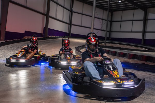 EDGE Speedway Go Kart Track - The immersive Power Up Go Karting Game experience is achieved by driving over tiles embedded in the go-kart track to earn “powers,” that when strategically used can increase the driver’s chances of winning the race. Powers include “Boosts” that will increase the speed of the kart for a limited time; “Zone Slow” that will slow down karts in the same area while that kart’s speed remains the same; “Turtle Mode” that will slow down all the karts on the track except the driver with this power; and “Shield”, a defensive power that will prevent other racers from slowing down that kart. Other special effects are built into specific “zones” around the track.