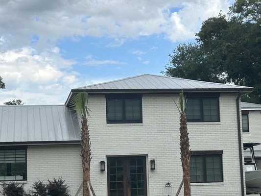 "The Works" - We cleaned the exterior of the home + roof + gutters.
