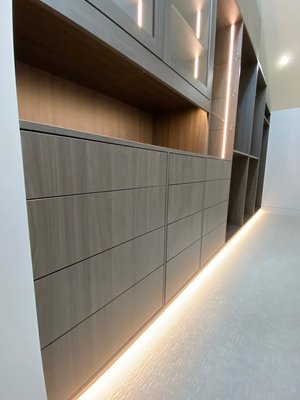 Elevated Lighting Closet - Timeless materials with a sleek no handles finish all hardware is push open with soft close drawers. Egger material and TAG Closet Hardware Elevated Lighting Closet - Timeless materials with a sleek no handles finish all hardware is push open with soft close drawers. Egger material and TAG Closet Hardware
