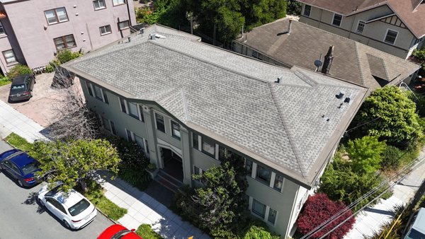 Flat & Pitched Roof Replacement in Oakland, CA by ELM Roofing Contractors - This recent project in Oakland, CA combined both pitched and flat roofing systems across a 2,000 sq ft multifamily property. Our team at ELM Roofing Contractors was called in to handle a full roof replacement that required both composition shingles and commercial-grade torch-down installation.
We began by removing up to two layers of aging asphalt shingles from the pitched 1,600 sq ft section. After full tear-off, we cleaned the roof deck thoroughly and performed wood repairs in areas with rot or weakness. For this portion, we installed GAF synthetic underlayment for a durable, moisture-resistant base. We then laid down Landmark asphalt shingles, which offer both curb appeal and proven performance. The installation was finished with all-new jacks, flashing, and matching ridge caps.
The flat 400 sq ft section required a different approach. We used a 3-ply torch-down roofing system built with CertainTeed granulated modified bitumen — a long-lasting commercial roofing material that offers excellent water resistance and UV protection. All seams were sealed, and edge flashing was fitted to ensure long-term reliability.
Each phase of this project — tear-off, installation, sealing, and cleanup — was completed by our roofing contractors with care and attention to detail. We take pride in delivering roofing solutions that last, no matter the complexity of the job.
By combining residential-style shingles with commercial roofing materials, ELM Roofing Contractors delivered a unified system that blends appearance with durability — ideal for multi-unit or mixed-use properties in the Oakland, CA area. Flat & Pitched Roof Replacement in Oakland, CA by ELM Roofing Contractors - This recent project in Oakland, CA combined both pitched and flat roofing systems across a 2,000 sq ft multifamily property. Our team at ELM Roofing Contractors was called in to handle a full roof replacement that required both composition shingles and commercial-grade torch-down installation.
We began by removing up to two layers of aging asphalt shingles from the pitched 1,600 sq ft section. After full tear-off, we cleaned the roof deck thoroughly and performed wood repairs in areas with rot or weakness. For this portion, we installed GAF synthetic underlayment for a durable, moisture-resistant base. We then laid down Landmark asphalt shingles, which offer both curb appeal and proven performance. The installation was finished with all-new jacks, flashing, and matching ridge caps.
The flat 400 sq ft section required a different approach. We used a 3-ply torch-down roofing system built with CertainTeed granulated modified bitumen — a long-lasting commercial roofing material that offers excellent water resistance and UV protection. All seams were sealed, and edge flashing was fitted to ensure long-term reliability.
Each phase of this project — tear-off, installation, sealing, and cleanup — was completed by our roofing contractors with care and attention to detail. We take pride in delivering roofing solutions that last, no matter the complexity of the job.
By combining residential-style shingles with commercial roofing materials, ELM Roofing Contractors delivered a unified system that blends appearance with durability — ideal for multi-unit or mixed-use properties in the Oakland, CA area.
