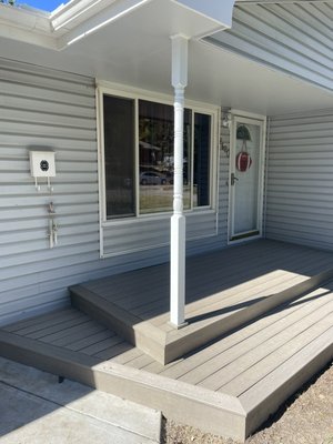 Porch on 46th and Center - This was a porch that was updated with composite deck boards. A cedar decorated post was installed and painted to increase the property’s curb appeal. Porch on 46th and Center - This was a porch that was updated with composite deck boards. A cedar decorated post was installed and painted to increase the property’s curb appeal.