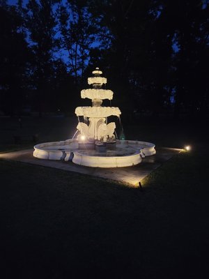 Outside Fountain repair - After many years of this fountain not working, the customer decided it was time.  We cleaned it out, replaced the pump, rewired everything and tested it.  The customer took these pictures at night to show it lit up.  It's beautiful.