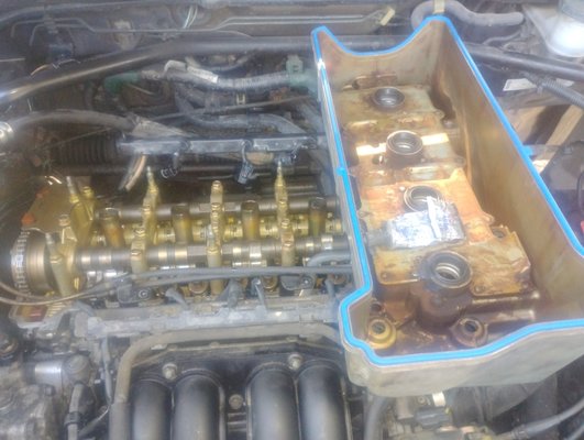 valve cover gasket - This was a valve cover gasket replacement on a honda crv, customer stats oil leaking on muffler and smoking.  removed valve cover and cleaned and resealed cover.  came out perfect and customer was happy.