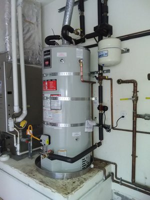 75 gallon water heater with new recirulation pump - We found a leaking 8 year old 75 gallon in the this home.  The previous contractor did not bring the heater up to code, or replace any of the rotting connections.  The old recir pump was also rotting, and not supplying instant hot water.  We rplaced the unit, brought it up to current code, and replaced the recir pump in the first visit.  Thats right, ONE visit!