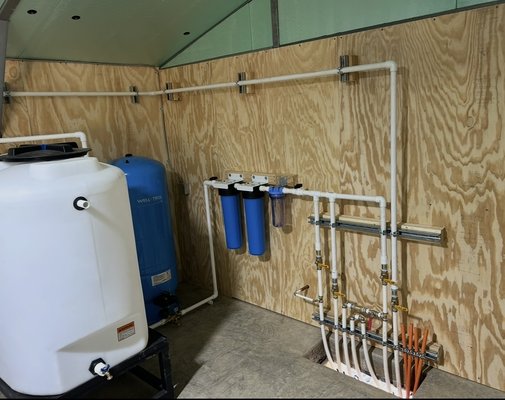 Low Producing Well Solution - Low-Producing Well Solution
This property was struggling with a low-producing well and running out of water. We installed a water storage/holding tank system to build up a reserve supply, along with an Amtrol pressure tank, pump protection system, and custom manifold to distribute water throughout the property.
The result: a more dependable water supply, added protection for the well pump, and a clean, organized system designed to serve the entire property. Low Producing Well Solution - Low-Producing Well Solution
This property was struggling with a low-producing well and running out of water. We installed a water storage/holding tank system to build up a reserve supply, along with an Amtrol pressure tank, pump protection system, and custom manifold to distribute water throughout the property.
The result: a more dependable water supply, added protection for the well pump, and a clean, organized system designed to serve the entire property.