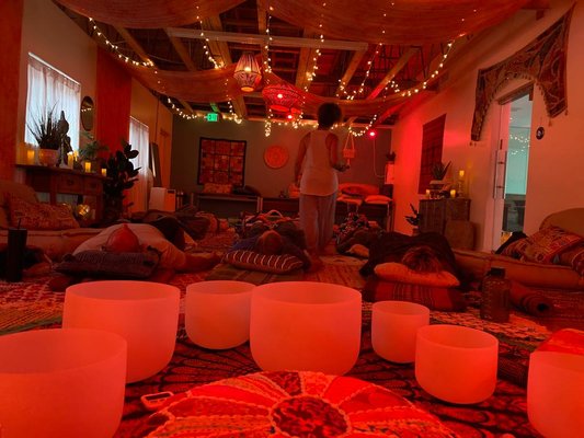 Sound Baths - Step into a world of serenity with a sound bath—a deeply immersive and therapeutic sonic experience that rejuvenates the mind, body, and soul. In this unique healing practice, participants are enveloped in a symphony of soothing sounds created by various instruments like crystal singing bowls, gongs, chimes, and drums. As the sound bath begins, the calming vibrations wash over you, creating a sense of tranquility and inner stillness. The sounds reverberate through every cell, dissolving stress, anxiety, and tension. With each note, the mind finds peace, and the body enters a state of deep relaxation. Beyond its immediate calming effects, a sound bath offers a myriad of benefits for overall well-being. It can help reduce stress and anxiety levels, enhance mindfulness, and promote better sleep. Many practitioners also report improved focus, heightened creativity, and a greater sense of emotional clarity after experiencing a sound bath.