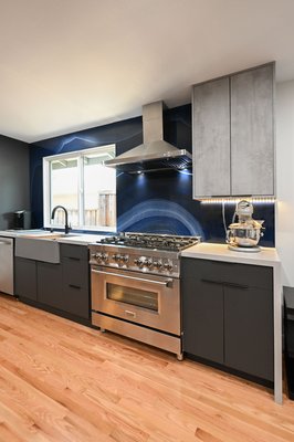 High-End Kitchen Transformation - Our recent newly remodeled kitchen with newly installed hardwood floors, and a a dining kitchen island.