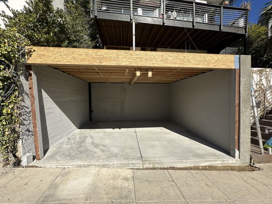 Garage Expansion Project - We recently completed this garage expansion project in Silver Lake, featuring retaining walls, structural framing for a roof deck, and a new foundation. The upgrade turned a one-car garage into a spacious two-car setup, giving the client the extra space he was looking for.