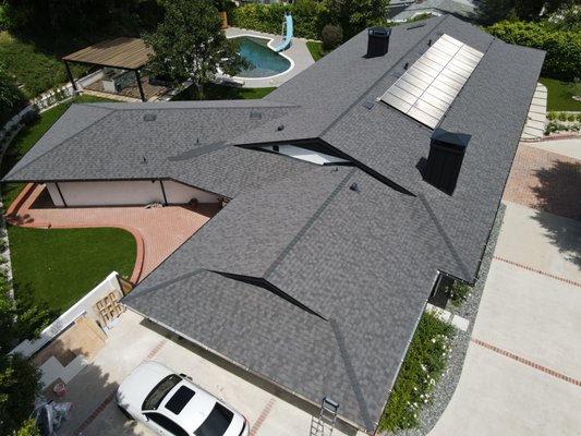 Architectural Shingle Roof Replacement - We’ve transformed this expansive 8000 Sqft home!
Initially, the homeowner was hesitant to address any issues with their roof, dismissing it as unimportant. However, we’ve proven that every aspect of a home deserves attention. The homeowners are thrilled with the results, evident in the spectacular work you can see. Our enhancements include a sleek black cool roof, a new low-emissivity skylight, solar panel integration, meticulous rearrangement and tune-up, along with expert re-sloping to optimize gutter function. Additionally, we’ve managed DWV systems and corrected sizing issues, culminating in what I believe is our best chimney cladding to date. We’re proud to have exceeded expectations and delivered a home that not only looks stunning but also functions flawlessly.
Reach out for your FREE ESTIMATE today! Architectural Shingle Roof Replacement - We’ve transformed this expansive 8000 Sqft home!
Initially, the homeowner was hesitant to address any issues with their roof, dismissing it as unimportant. However, we’ve proven that every aspect of a home deserves attention. The homeowners are thrilled with the results, evident in the spectacular work you can see. Our enhancements include a sleek black cool roof, a new low-emissivity skylight, solar panel integration, meticulous rearrangement and tune-up, along with expert re-sloping to optimize gutter function. Additionally, we’ve managed DWV systems and corrected sizing issues, culminating in what I believe is our best chimney cladding to date. We’re proud to have exceeded expectations and delivered a home that not only looks stunning but also functions flawlessly.
Reach out for your FREE ESTIMATE today!