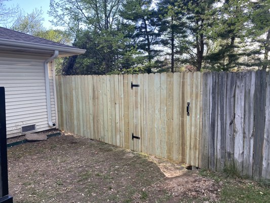 Build new fence for customer - I rebuilt a 6 foot wooden fence with an entry door for lawnmowers to go through!