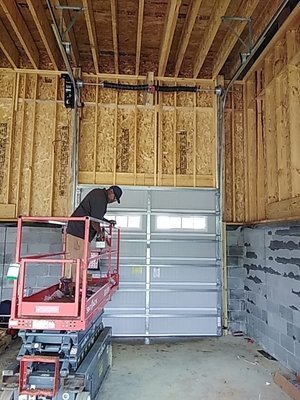 High Lift Garage Door - Vertical Lift Tracks lift the door straight up, providing maximum headroom and clearance. They are ideal for garage spaces with high ceilings, ample storage, and taller vehicle accommodation.
Benefits of High Lift Garage Door Tracks:
* Increased Headroom: The primary advantage of high lift garage door tracks is maximizing headroom. Lifting the door higher up creates a spacious environment where you can move freely without worrying about door height.
* Taller Vehicle Accommodation: High lift tracks allow for parking taller vehicles, such as SUVs or RVs. This flexibility is especially beneficial for those with larger vehicles or needing additional storage space.
* Accommodate a Car Lift: The high lift system keeps your garage door away from the car on top of your lift.
* Enhanced Storage Options: With high lift tracks, you can use the increased vertical clearance to store items overhead, freeing up valuable floor space. From bicycles and sporting equipment to seasonal decorations, the possibilities are endless.
Lion Garage Door Repair & Installation High Lift Garage Door - Vertical Lift Tracks lift the door straight up, providing maximum headroom and clearance. They are ideal for garage spaces with high ceilings, ample storage, and taller vehicle accommodation.
Benefits of High Lift Garage Door Tracks:
* Increased Headroom: The primary advantage of high lift garage door tracks is maximizing headroom. Lifting the door higher up creates a spacious environment where you can move freely without worrying about door height.
* Taller Vehicle Accommodation: High lift tracks allow for parking taller vehicles, such as SUVs or RVs. This flexibility is especially beneficial for those with larger vehicles or needing additional storage space.
* Accommodate a Car Lift: The high lift system keeps your garage door away from the car on top of your lift.
* Enhanced Storage Options: With high lift tracks, you can use the increased vertical clearance to store items overhead, freeing up valuable floor space. From bicycles and sporting equipment to seasonal decorations, the possibilities are endless.
Lion Garage Door Repair & Installation