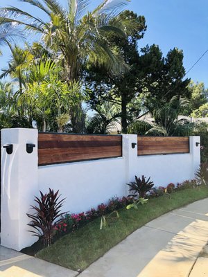 Encinitas Elegance: A Stucco and Wood Wall Build with Wrought Iron Framing - Spyglass Construction was hired by a client to design and construct a decorative wall for their property that would enhance the overall aesthetics of their outdoor living space. The goal was to create a visually stunning wall that would provide privacy while also being functional.
Project Details:
Spyglass Construction's team designed a wall that comprised of a combination of stucco and wood, with wrought iron framing and a hard Brazil wood top. The wall was built to provide privacy while adding to the aesthetics of the house.
The stucco was carefully applied to create a smooth finish that would complement the overall look and feel of the property. The wood panels were made from high-quality materials and stained to match the wrought iron framing. The hard Brazil wood top added a touch of sophistication to the overall design, making it stand out from other decorative walls.
To construct the wall, Spyglass Construction's team first laid the foundation, ensuring that it was strong and stable. They then installed the wrought iron framing and began assembling the wood panels. Once the panels were secured in place, they carefully applied the stucco to create a seamless finish.
The final result was a visually stunning wall that added both beauty and function to the property. The hard Brazil wood top provided a luxurious touch, while the wrought iron framing added a touch of elegance. The combination of stucco and wood created a natural look that blended seamlessly with the surrounding landscape.
Conclusion:
Overall, Spyglass Construction's Stucco and Wood Wall with Wrought Iron Framing and Hard Brazil Wood Top project was a success. The client was thrilled with the final result, and the wall now stands as a testament to the quality and craftsmanship of Spyglass Construction. Encinitas Elegance: A Stucco and Wood Wall Build with Wrought Iron Framing - Spyglass Construction was hired by a client to design and construct a decorative wall for their property that would enhance the overall aesthetics of their outdoor living space. The goal was to create a visually stunning wall that would provide privacy while also being functional.
Project Details:
Spyglass Construction's team designed a wall that comprised of a combination of stucco and wood, with wrought iron framing and a hard Brazil wood top. The wall was built to provide privacy while adding to the aesthetics of the house.
The stucco was carefully applied to create a smooth finish that would complement the overall look and feel of the property. The wood panels were made from high-quality materials and stained to match the wrought iron framing. The hard Brazil wood top added a touch of sophistication to the overall design, making it stand out from other decorative walls.
To construct the wall, Spyglass Construction's team first laid the foundation, ensuring that it was strong and stable. They then installed the wrought iron framing and began assembling the wood panels. Once the panels were secured in place, they carefully applied the stucco to create a seamless finish.
The final result was a visually stunning wall that added both beauty and function to the property. The hard Brazil wood top provided a luxurious touch, while the wrought iron framing added a touch of elegance. The combination of stucco and wood created a natural look that blended seamlessly with the surrounding landscape.
Conclusion:
Overall, Spyglass Construction's Stucco and Wood Wall with Wrought Iron Framing and Hard Brazil Wood Top project was a success. The client was thrilled with the final result, and the wall now stands as a testament to the quality and craftsmanship of Spyglass Construction.