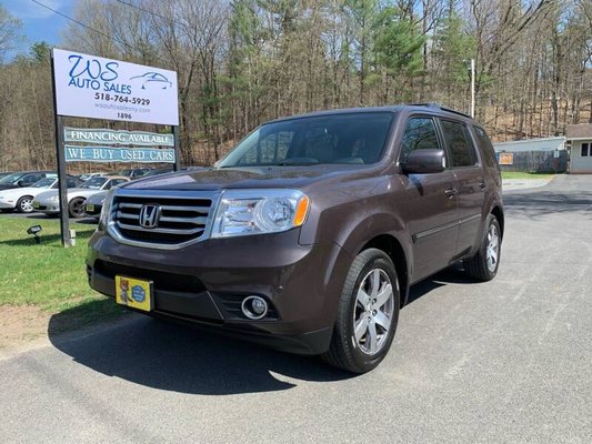 2013 Honda Pilot Touring Edition - This 2013 Honda Pilot Touring Edition has a CARFAX Buy Back Guarantee from WS Auto Sales so you can buy with confidence that there are no undisclosed history problems. Professionally detailed and in excellent physical and mechanical condition.
This Pilot comes with 3.5 V6 Engine, 5 speed Automatic Transmission and 4 Wheel drive that still gets 24 MPG on the highway! The Touring trim level comes with a Power sliding Moon Roof, Navigation System, Heated Leather Seating, DVD Player, Keyless entry, Rear backup Camera, USB and AUX inputs, Alloy wheels, Bluetooth, Dual Climate Control, Steering Wheel Controls, Factory Roof Rack, Third Row Seat, which gives it 8 passenger seating total and so much more!
Financing and Extended Warranties Available. Please call (518) 764-5929 for more information and availability. 2013 Honda Pilot Touring Edition - This 2013 Honda Pilot Touring Edition has a CARFAX Buy Back Guarantee from WS Auto Sales so you can buy with confidence that there are no undisclosed history problems. Professionally detailed and in excellent physical and mechanical condition.
This Pilot comes with 3.5 V6 Engine, 5 speed Automatic Transmission and 4 Wheel drive that still gets 24 MPG on the highway! The Touring trim level comes with a Power sliding Moon Roof, Navigation System, Heated Leather Seating, DVD Player, Keyless entry, Rear backup Camera, USB and AUX inputs, Alloy wheels, Bluetooth, Dual Climate Control, Steering Wheel Controls, Factory Roof Rack, Third Row Seat, which gives it 8 passenger seating total and so much more!
Financing and Extended Warranties Available. Please call (518) 764-5929 for more information and availability.