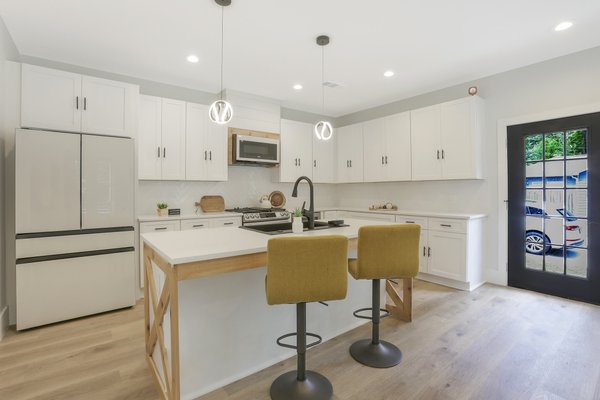 Kitchen remodel - 1929 North Av - Step into a stunning transformation where the charm of the 1960s meets the sophistication of modern design. This remodeled kitchen seamlessly blends nostalgic character with contemporary elegance. The heart of the space features sleek, white shaker cabinets that provide a clean, timeless look, perfectly complemented by the convenience of soft-close mechanisms for a touch of luxury in everyday use.
Enhancing the kitchen's aesthetic, subtle cedar accents are strategically integrated throughout, adding warmth and a hint of rustic charm that pays homage to the original era. These natural wood elements create a harmonious balance against the backdrop of pristine white cabinetry, infusing the space with an inviting and organic feel.
Equipped with state-of-the-art Samsung Bespoke appliances, the kitchen exudes modern efficiency and style. These high-quality appliances are not only technologically advanced but also customizable to suit the homeowner's unique taste, ensuring that function meets fashion effortlessly.
Underfoot, sleek flooring ties the room together, while strategically placed lighting highlights the kitchen's features, creating a bright and airy environment. This kitchen is a testament to thoughtful design, where past and present converge to create a space that is both practical and visually stunning, perfect for culinary enthusiasts and design aficionados alike. Kitchen remodel - 1929 North Av - Step into a stunning transformation where the charm of the 1960s meets the sophistication of modern design. This remodeled kitchen seamlessly blends nostalgic character with contemporary elegance. The heart of the space features sleek, white shaker cabinets that provide a clean, timeless look, perfectly complemented by the convenience of soft-close mechanisms for a touch of luxury in everyday use.
Enhancing the kitchen's aesthetic, subtle cedar accents are strategically integrated throughout, adding warmth and a hint of rustic charm that pays homage to the original era. These natural wood elements create a harmonious balance against the backdrop of pristine white cabinetry, infusing the space with an inviting and organic feel.
Equipped with state-of-the-art Samsung Bespoke appliances, the kitchen exudes modern efficiency and style. These high-quality appliances are not only technologically advanced but also customizable to suit the homeowner's unique taste, ensuring that function meets fashion effortlessly.
Underfoot, sleek flooring ties the room together, while strategically placed lighting highlights the kitchen's features, creating a bright and airy environment. This kitchen is a testament to thoughtful design, where past and present converge to create a space that is both practical and visually stunning, perfect for culinary enthusiasts and design aficionados alike.