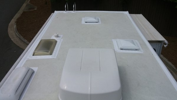 RV Roof seam & component tape job - RV roof issue(s)... water leaks and/or tired of spending and/or doing all of that resealing every 6 mos. to a year. Then don't... Do what this customer did and spend a little more money upfront, to get all of your sealant issues (Dicor) problems taken care of all at once. You ask how??? Check it out... 

This customer was tired of having to spend about $300-400 per year to get their unit (spot) re-sealed. They would get up there and find that after just 3-6 mos. that their Dicor sealant had cracks and voids in it leading to possible water damage. Of course, we all know that water will find the path of least resistance, so give it an inch and it will take a mile. The customer got up on the roof of their unit just in time to find that the front seam of their RV, on the driver's side, had cracked open and was just starting to get some water intake in that area and get a soft spot. If there would have been 1-2 more substantial rainstorms, then that damage would have turned into thousands of dollars in damages/repairs.  How do you stop this problem... Easy!

So, the best thing to do, especially in Texas, with all of the heat, UV rays, elements, etc. issues that we have, is to spend a little extra money up front and get ALL of the roof's seams and components taped off. This will allow the Eturnabond tape to be laid over the Dicor sealant, thus covering all of the screws that are under all of the Dicor sealant. The Eturnabond tape will adhere to the roof, with the right prep, and then will safely secure it. This alleviates you having to get on you roof every 3-6 months and having to check your sealants, to just having to do it every year to make sure nothing has damaged your roof rubber membrane. And this WILL last you for years to come...

That way, in just a few years' time you are putting money back into your pocket and you have yourself a worry-free roof, with NO major water damage repairs to worry about and very little roof maintenance to do as well. I always tell our customers, if you are purchasing a new or used RV, then have it done right away. And, if you have had your RV for a little bit or even a number of years, then get your roof's seams and components taped today, before it is too late!