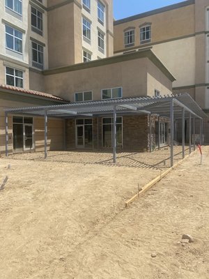 Trellis - New custom fabrication and installation of steel trellis at hotel rear by pool area. Trellis - New custom fabrication and installation of steel trellis at hotel rear by pool area.