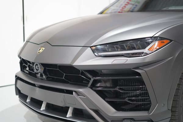 Lamborghini Urus Matte Wrap - As you can see, we've completely transformed this Urus with a custom matte black wrap. When we get a vehicle like this, we don't just slap the film on. We take our time with every detail. We spent a full day just getting the surface prepped, deep cleaning, clay barring, and making sure it's perfect. Then, we meticulously apply the film, and on a car with so many complex angles, that's where the real craftsmanship comes in. We actually take off parts like the emblems to wrap the film into every edge, making sure there are no visible paint lines. That's how you get this seamless, painted look.
After the wrap is installed, we spend hours doing a final inspection. We go over every inch of the vehicle with a fine-tooth comb. We check every edge, every corner, and every seam to make sure everything is sealed down perfectly. We look for any tiny imperfections and ensure the material is fully bonded. The final result you see here isn't just a quick job, it's the product of hours of detailed, hands-on work to ensure the finish is flawless and will last for years to come. It’s not just about changing the color, it's about making sure it looks flawless from every angle and giving the car a completely new, unique identity. I'll never forget the customer's face when they first saw it. They just stood there for a good minute, didn't say anything, and then just said, "You nailed it." Lamborghini Urus Matte Wrap - As you can see, we've completely transformed this Urus with a custom matte black wrap. When we get a vehicle like this, we don't just slap the film on. We take our time with every detail. We spent a full day just getting the surface prepped, deep cleaning, clay barring, and making sure it's perfect. Then, we meticulously apply the film, and on a car with so many complex angles, that's where the real craftsmanship comes in. We actually take off parts like the emblems to wrap the film into every edge, making sure there are no visible paint lines. That's how you get this seamless, painted look.
After the wrap is installed, we spend hours doing a final inspection. We go over every inch of the vehicle with a fine-tooth comb. We check every edge, every corner, and every seam to make sure everything is sealed down perfectly. We look for any tiny imperfections and ensure the material is fully bonded. The final result you see here isn't just a quick job, it's the product of hours of detailed, hands-on work to ensure the finish is flawless and will last for years to come. It’s not just about changing the color, it's about making sure it looks flawless from every angle and giving the car a completely new, unique identity. I'll never forget the customer's face when they first saw it. They just stood there for a good minute, didn't say anything, and then just said, "You nailed it."