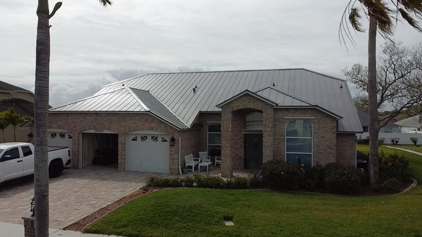 Standing Seam Roofing System - After a major hail storm ,customer asked for an inspection on his shingle roof. It was in bad shape, so insurance covered the cost of a new roof ,but customer wanted to upgrade so he chose this beautiful standing seam profile in a charcoal gray and as you can see the end result was amazing! Standing Seam Roofing System - After a major hail storm ,customer asked for an inspection on his shingle roof. It was in bad shape, so insurance covered the cost of a new roof ,but customer wanted to upgrade so he chose this beautiful standing seam profile in a charcoal gray and as you can see the end result was amazing!