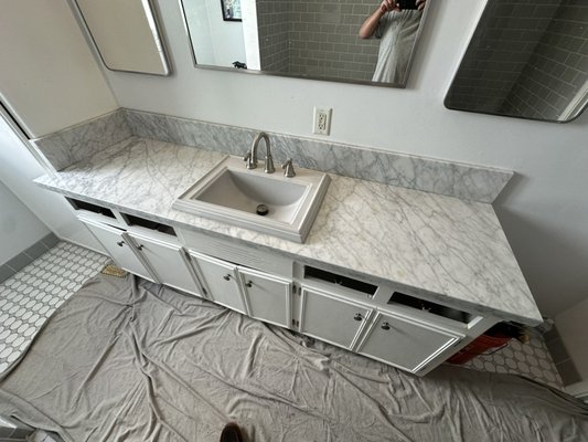 Grey calacatta vanity counter in Long Beach - For this job we picked up the counter in the morning, arrived at the customers home, proceeded to demo out the existing marble countertop and put in the grey calacatta quartz Grey calacatta vanity counter in Long Beach - For this job we picked up the counter in the morning, arrived at the customers home, proceeded to demo out the existing marble countertop and put in the grey calacatta quartz