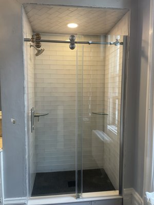 Bathroom remodel - Glass tile - Customer wanted a new shower installed. PHI had to strip the old shower to the studs and start from the beginning by pitching a new shower floor. Bathroom remodel - Glass tile - Customer wanted a new shower installed. PHI had to strip the old shower to the studs and start from the beginning by pitching a new shower floor.