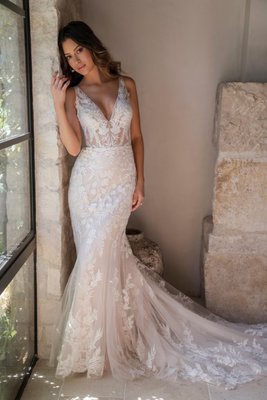 Allure Romance - Silky mikado and soft, lace-paneled crepe are the stars of our Allure Romance collection, which focuses on beautiful design and a return to simplicity. There are abundant ethereal touches — blush tones, our timeless lace and layers of soft tulle. Understated silhouettes and matte-finish fabrics lend modernity, while detachable trains add an exotic flair to bridal looks throughout the collection.

Price Range: $1500-2000