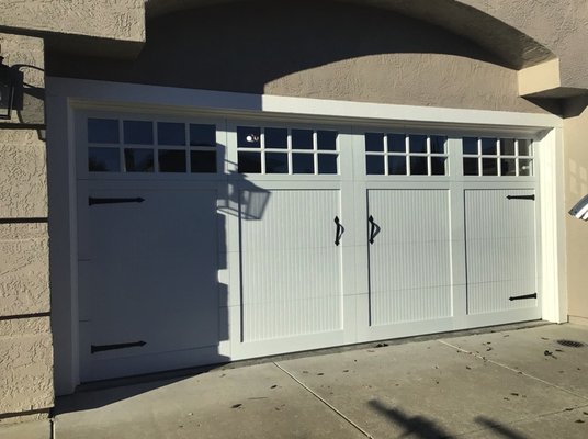 Cheshire Circle - Steel Overlay Garage Door Install - Steel overlay garage doors offer the perfect blend of durability and aesthetics for homeowners seeking a stylish and reliable option. These doors feature a steel base with a decorative overlay that mimics the look of natural wood. The steel construction ensures strength, security, and resistance to dents, warping, and rotting, making them ideal for long-term use. The overlay, available in various designs and finishes, adds a touch of elegance and warmth to the overall appearance of the garage door. With steel overlay garage doors, you can enjoy the beauty of wood without the high maintenance and susceptibility to weathering. Upgrade your home's curb appeal and enhance its value with the timeless appeal of steel overlay garage doors.