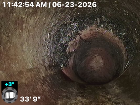 Cast Iron Sewer Line Descaling & Camera Inspection - Customer was experiencing concerns with the condition of an aging cast iron sewer line. We performed a sewer camera inspection and found heavy scale buildup restricting the pipe’s interior diameter. Mechanical descaling was performed to remove the buildup and restore proper flow. A final camera inspection was completed to verify the results and document the condition of the line after cleaning. Cast Iron Sewer Line Descaling & Camera Inspection - Customer was experiencing concerns with the condition of an aging cast iron sewer line. We performed a sewer camera inspection and found heavy scale buildup restricting the pipe’s interior diameter. Mechanical descaling was performed to remove the buildup and restore proper flow. A final camera inspection was completed to verify the results and document the condition of the line after cleaning.